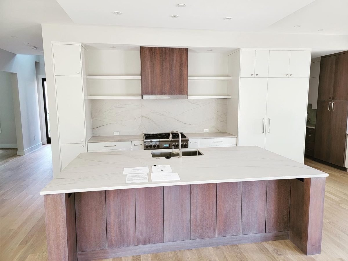Spacious white kitchen with island