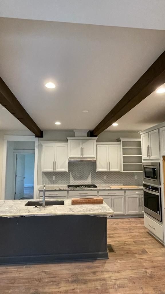 Kitchen with beams during remodeling