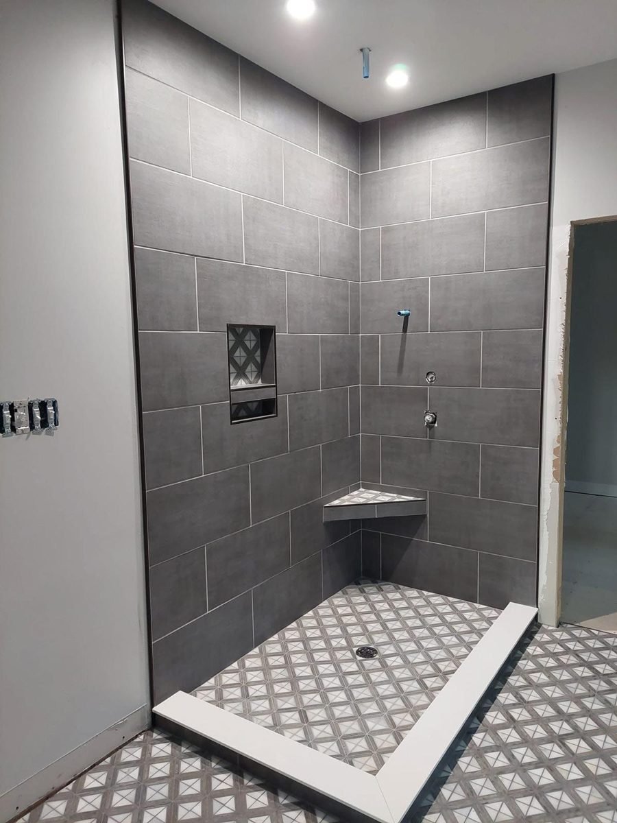 Shower with dark gray tile