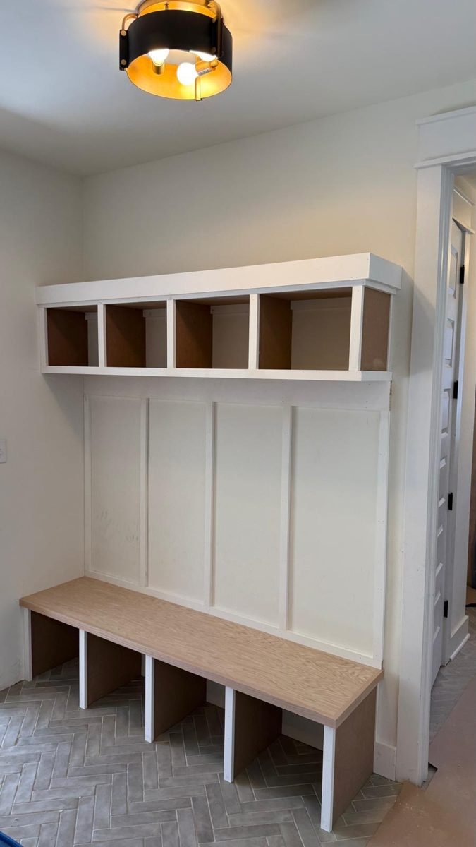 White mudroom bench and cubbies