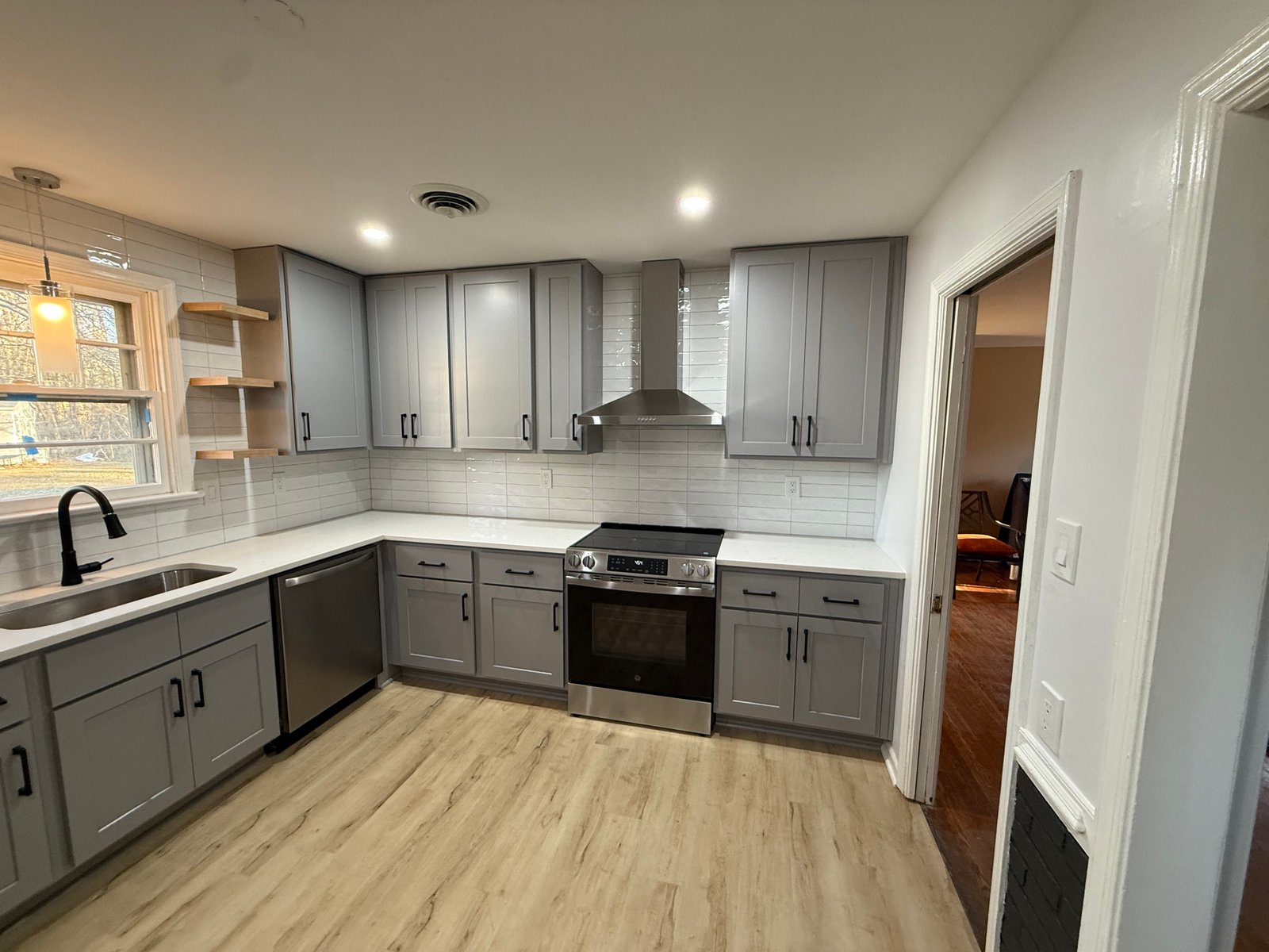 Gray kitchen remodeled by Yahweh Contractors